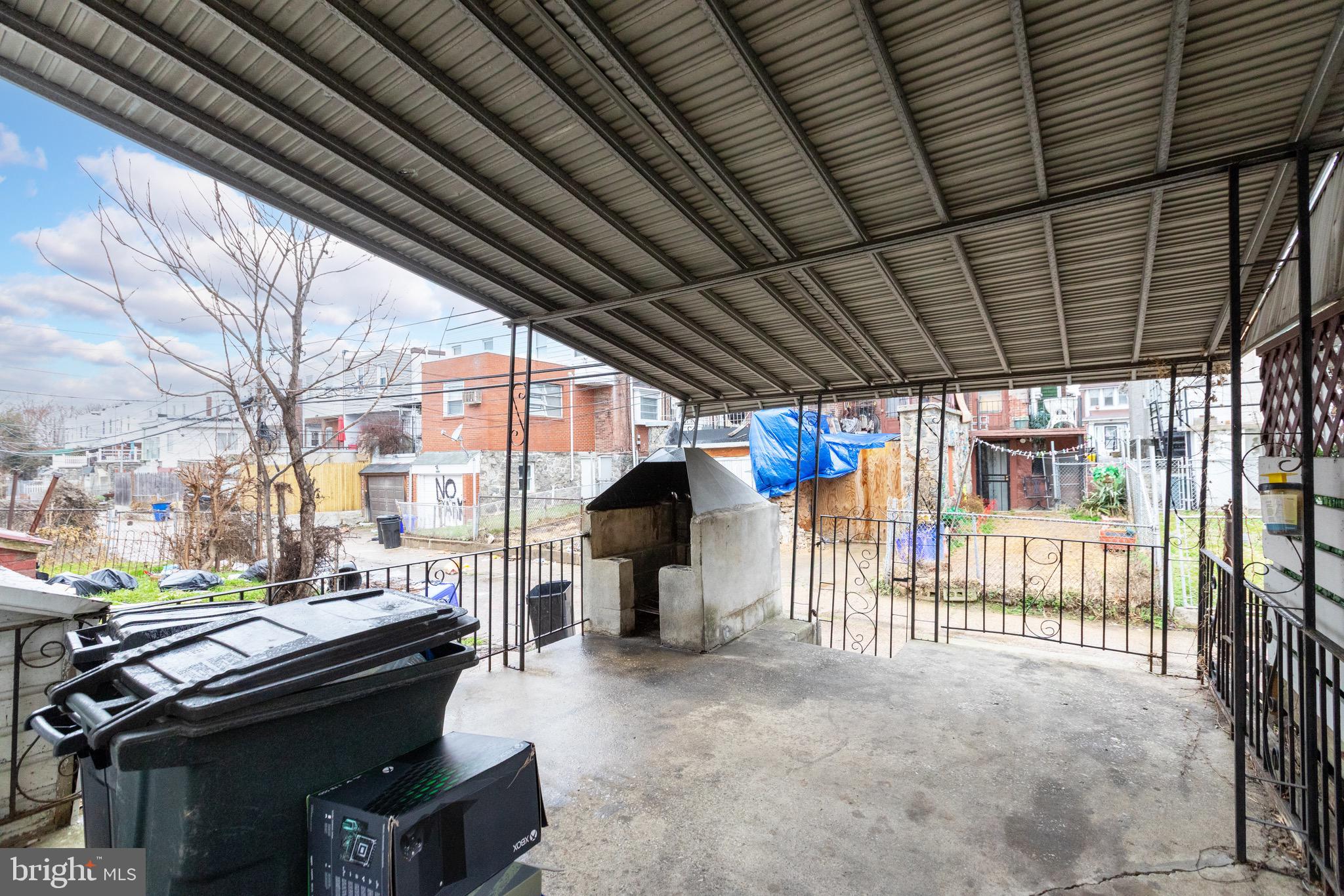 6209 Carpenter Street Philadelphia, PA 19143 - Photo 42 of 44 a view of a patio with a table and chairs