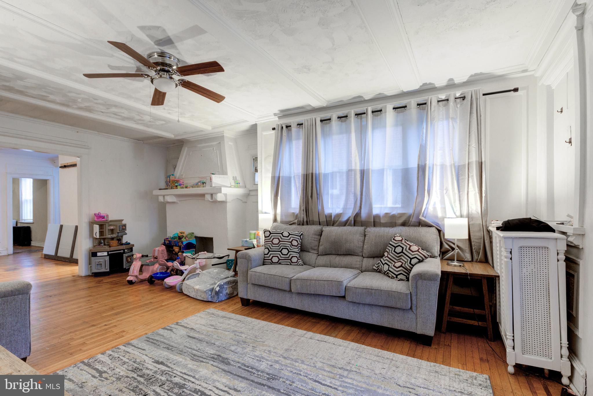 6209 Carpenter Street Philadelphia, PA 19143 - Photo 9 of 44 a living room with furniture and a wooden floor
