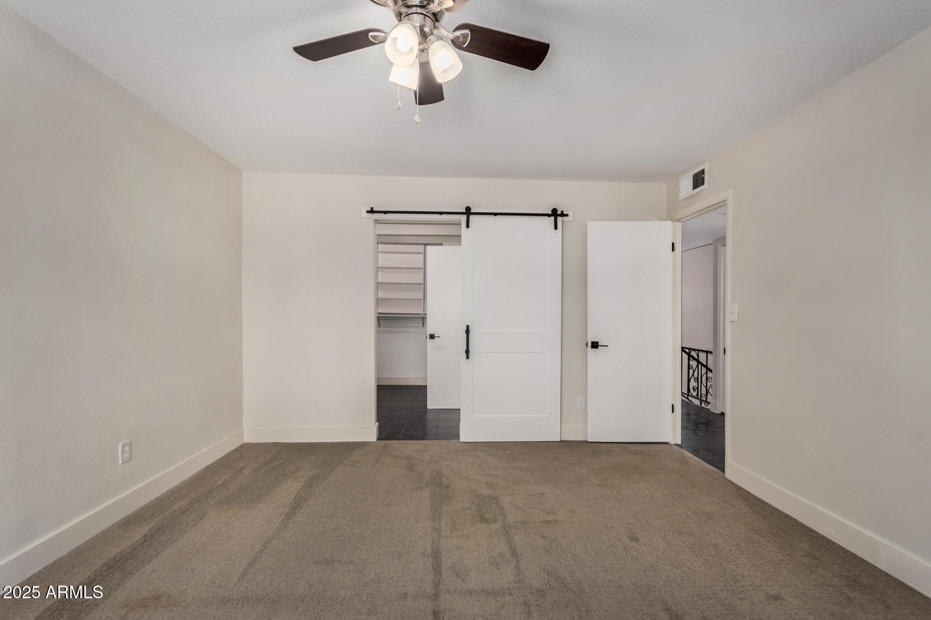7126 North 19th Avenue, Unit 169 Phoenix, AZ 85021 - Photo 15 of 30 a view of a livingroom with a ceiling fan & entryway