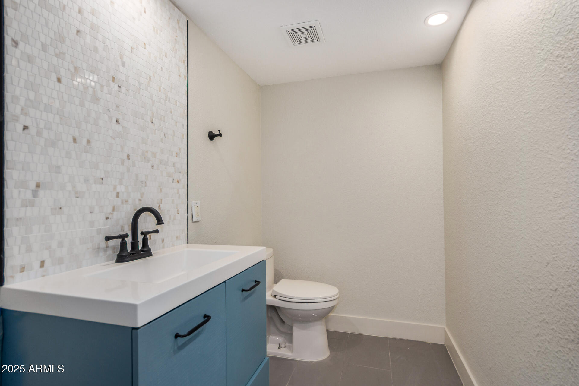 7126 North 19th Avenue, Unit 169 Phoenix, AZ 85021 - Photo 21 of 30 a bathroom with a sink a toilet and mirror