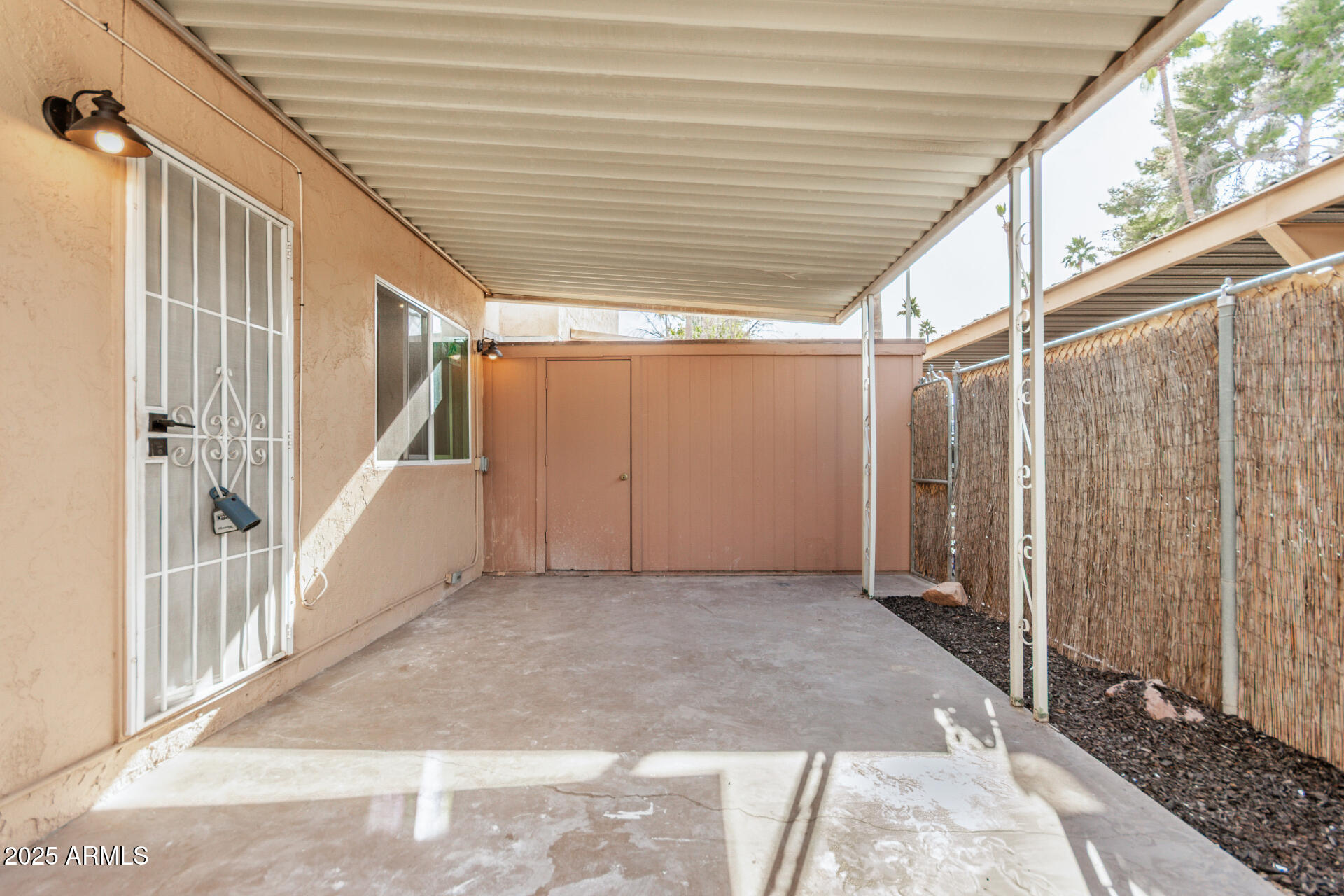 7126 North 19th Avenue, Unit 169 Phoenix, AZ 85021 - Photo 25 of 30 a view of a porch with wooden walls