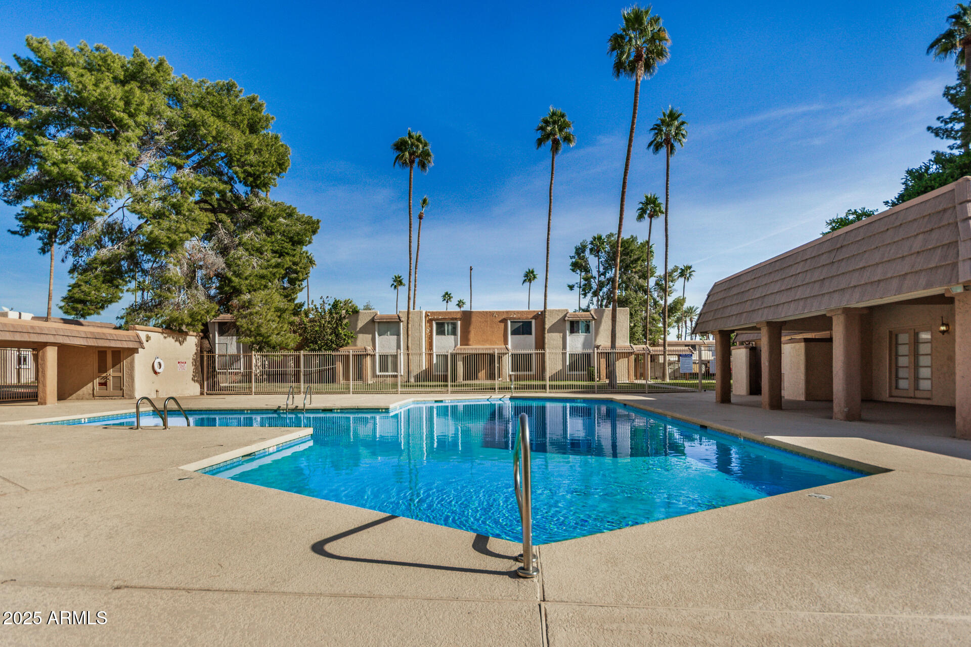 7126 North 19th Avenue, Unit 169 Phoenix, AZ 85021 - Photo 27 of 30 a view of a swimming pool with a lounge chair
