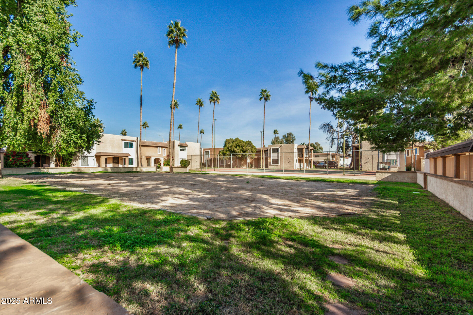 7126 North 19th Avenue, Unit 169 Phoenix, AZ 85021 - Photo 29 of 30 a backyard of a house with lots of green space