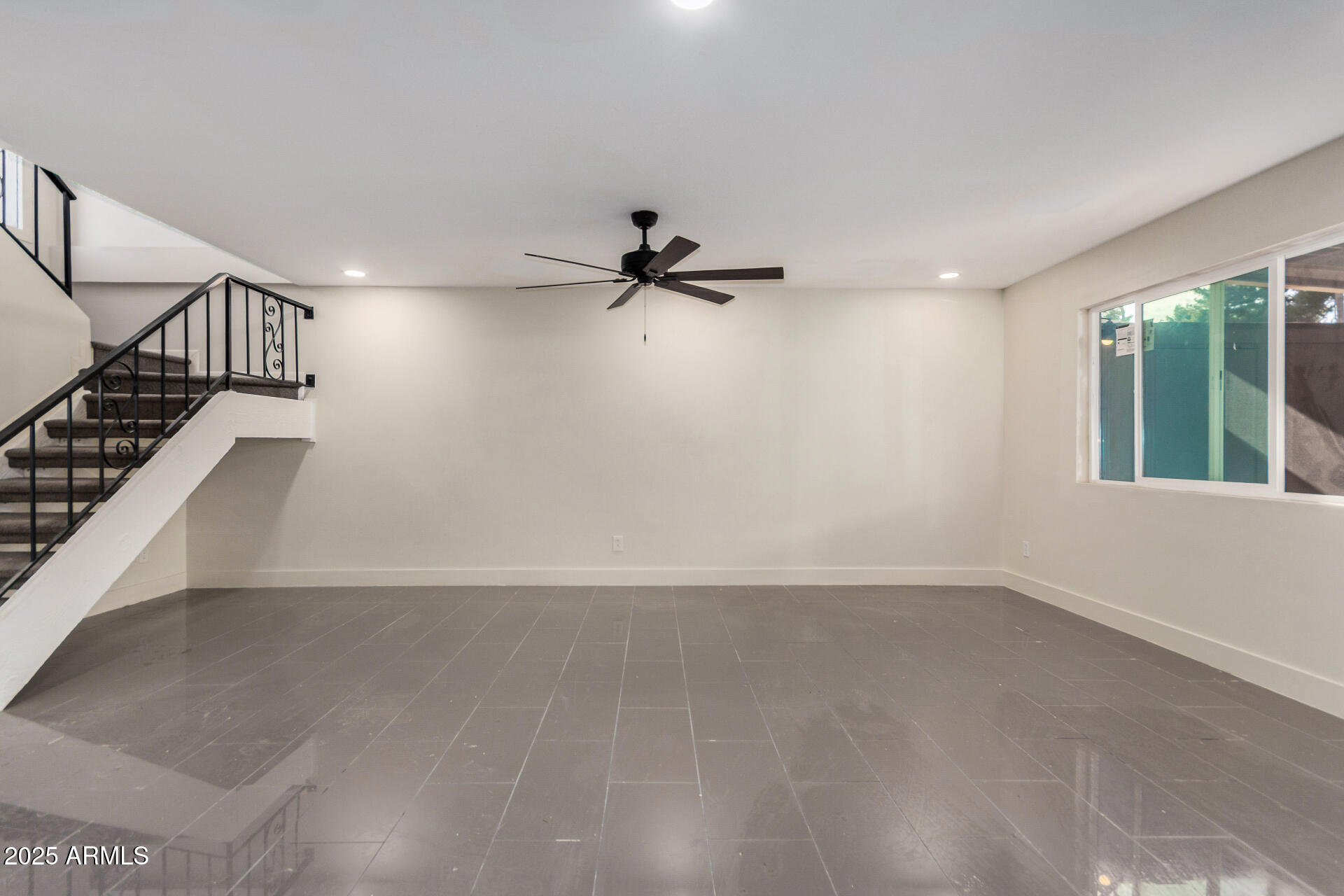 7126 North 19th Avenue, Unit 169 Phoenix, AZ 85021 - Photo 6 of 30 a view of an empty room with a window