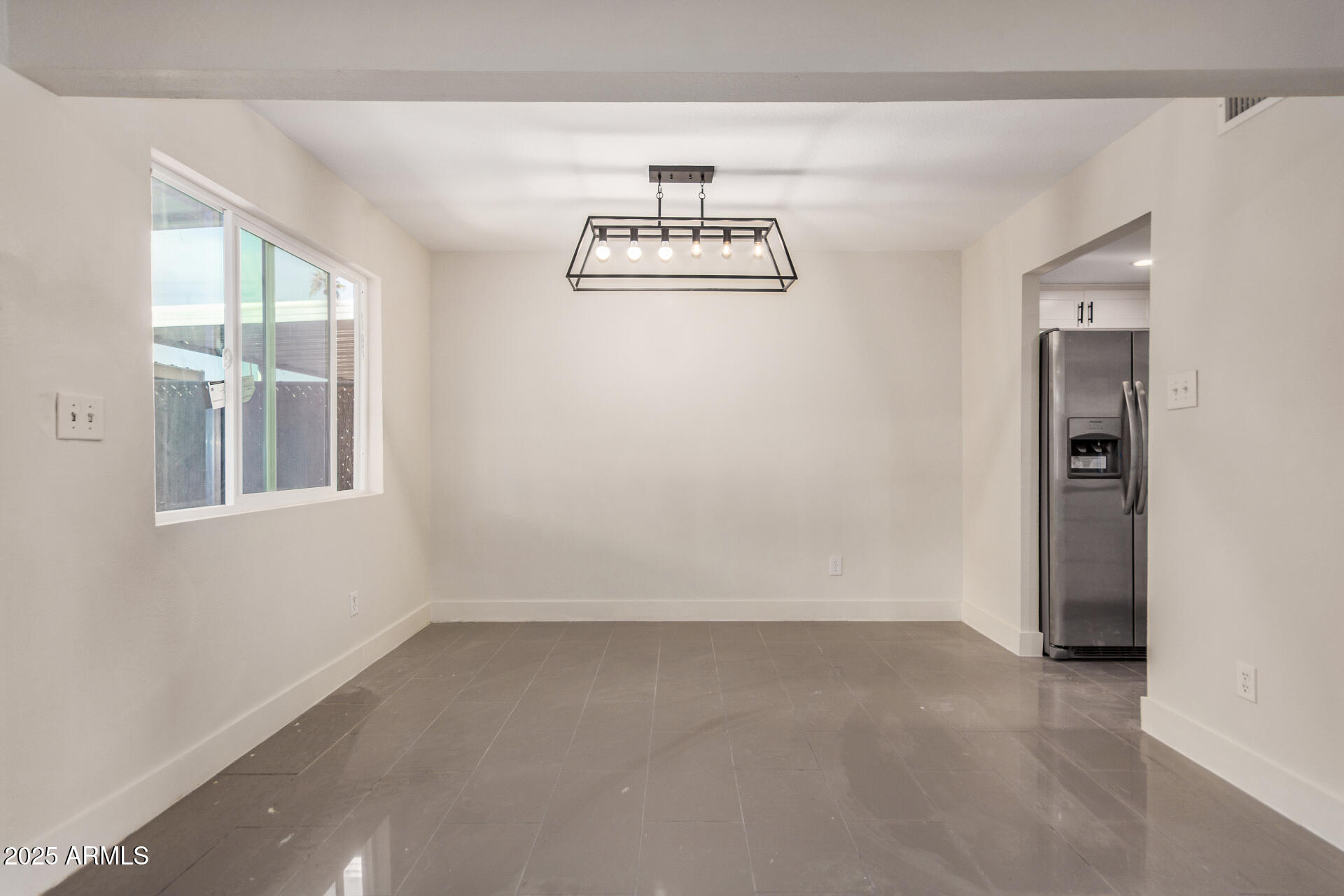 7126 North 19th Avenue, Unit 169 Phoenix, AZ 85021 - Photo 8 of 30 an empty room with a window