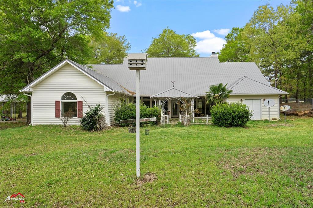 15280 Wynn School Road Hosston, LA 71043 - Photo 27 of 27 View of front of house featuring a chimney and a front lawn