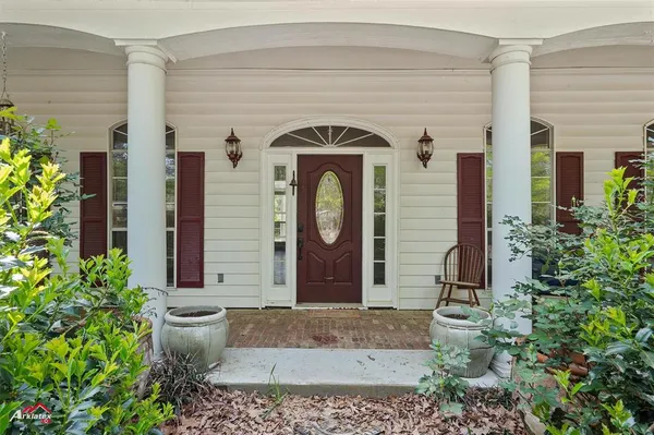 a view of a livingroom with furniture hardwood floor fireplace and a window
