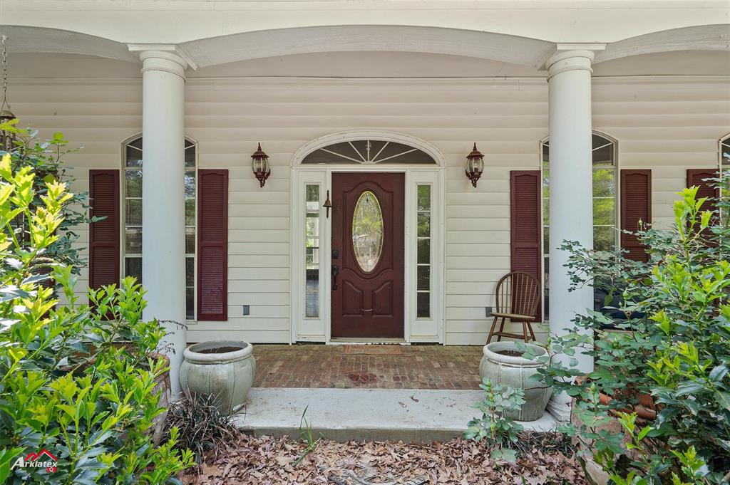 15280 Wynn School Road Hosston, LA 71043 - Photo 3 of 27 Property entrance featuring covered porch