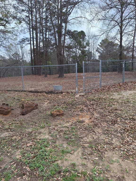 15280 Wynn School Road Hosston, LA 71043 - Photo 38 of 38 a backyard of a house with lots of green space