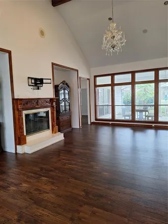 a kitchen with granite countertop a sink and a stove