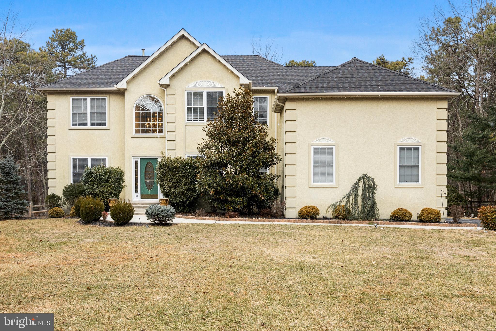 63 Highbridge Boulevard Medford, NJ 08055 - Photo 1 of 37 a front view of a house with a yard