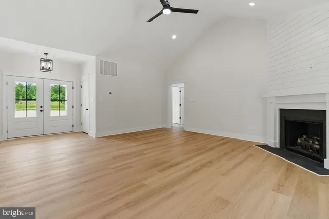 a kitchen with a sink window and cabinets