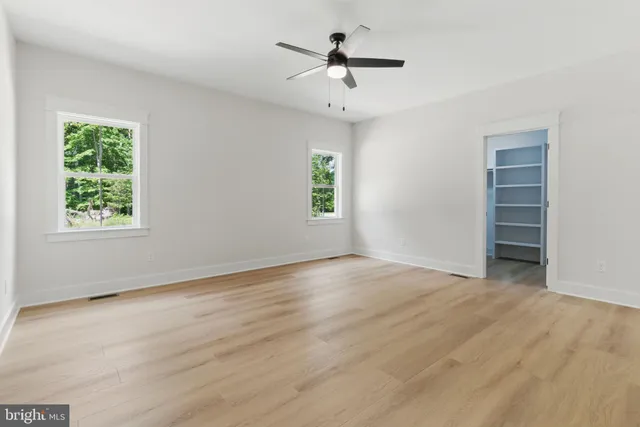 a bathroom with a shower and a sink