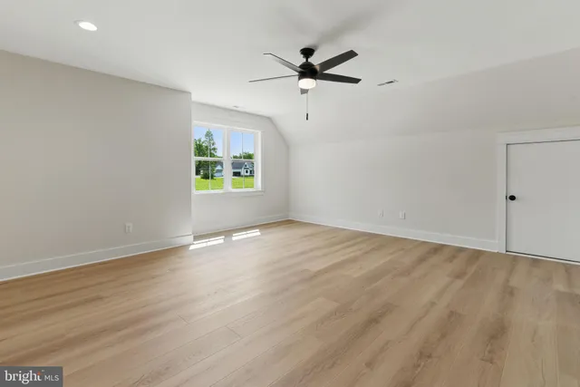 a view of a balcony with wooden floor