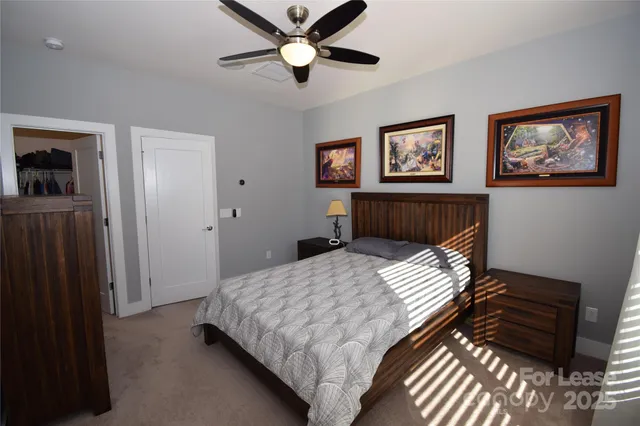 a bedroom with a bed and a walk in closet