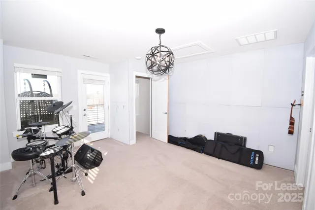 a bathroom with a sink a toilet a mirror and shower curtain