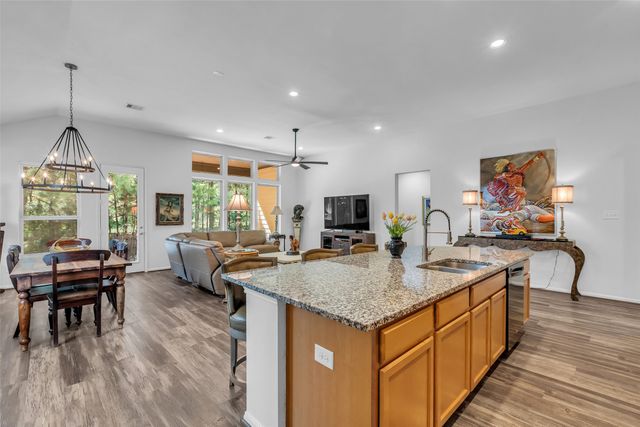 a view of kitchen island kitchen island dining table and wooden floor