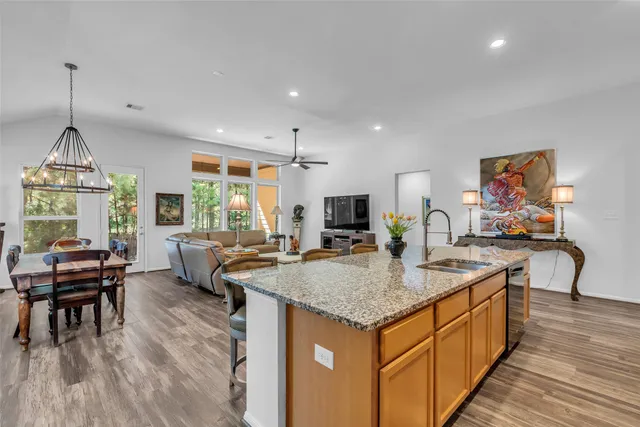 a view of kitchen island kitchen island dining table and wooden floor
