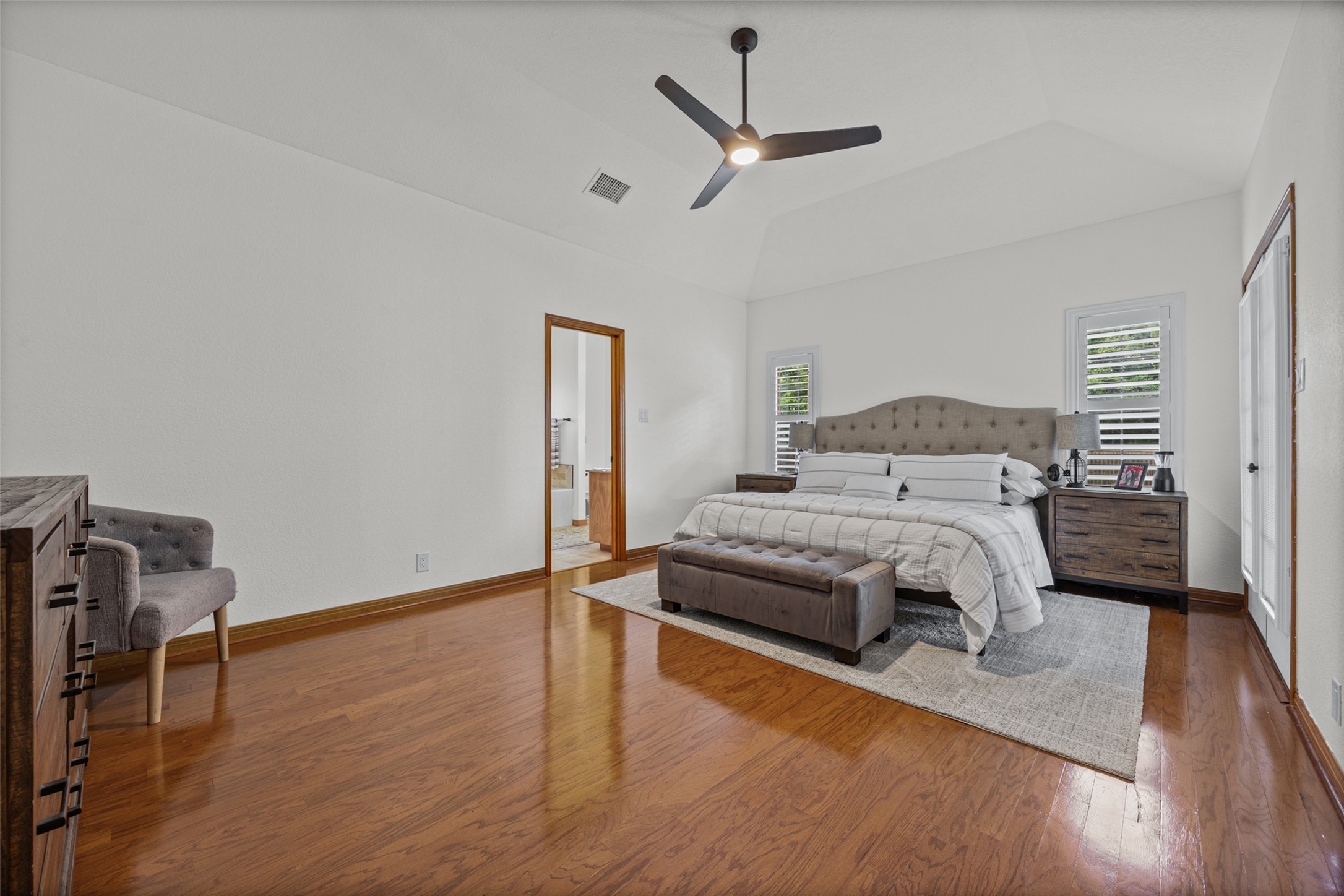 2000 Spinel Road Pflugerville, TX 78660 - Photo 15 of 31 Relax in this tranquil bedroom, featuring soaring vaulted ceilings and rich hardwood flooring.