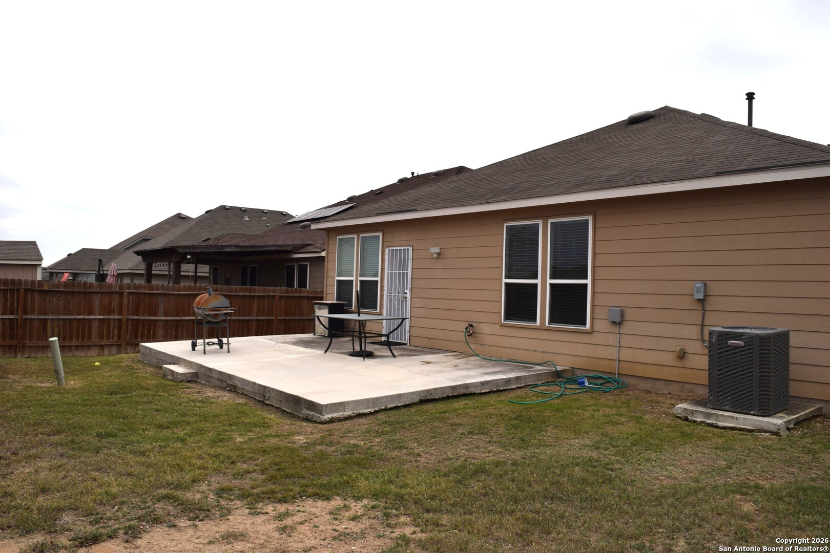 7215 Capricorn Way Converse, TX 78109 - Photo 21 of 22 a backyard of house with seating space