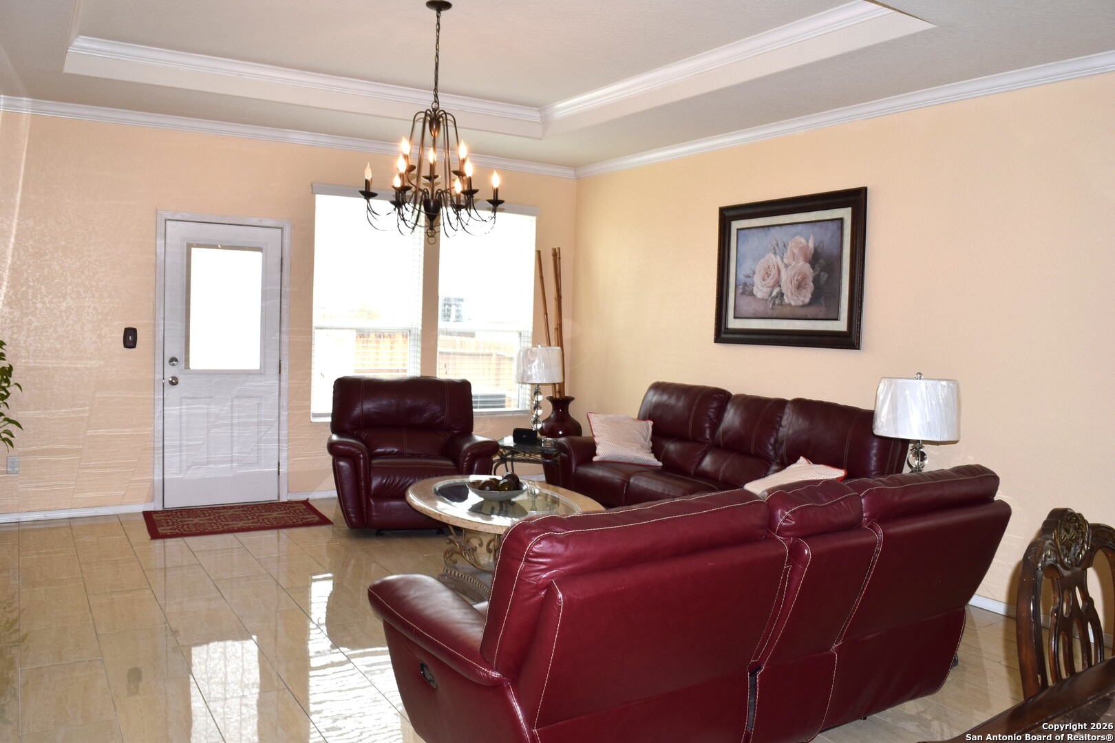 7215 Capricorn Way Converse, TX 78109 - Photo 3 of 22 a living room with furniture a chandelier and a window