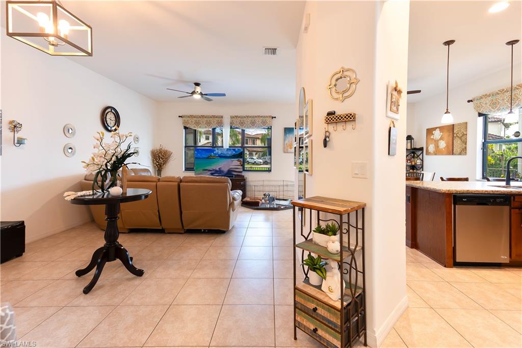 5092 Beckton Road Ave Maria, FL 34142 - Photo 11 of 36 a living room with furniture and a window