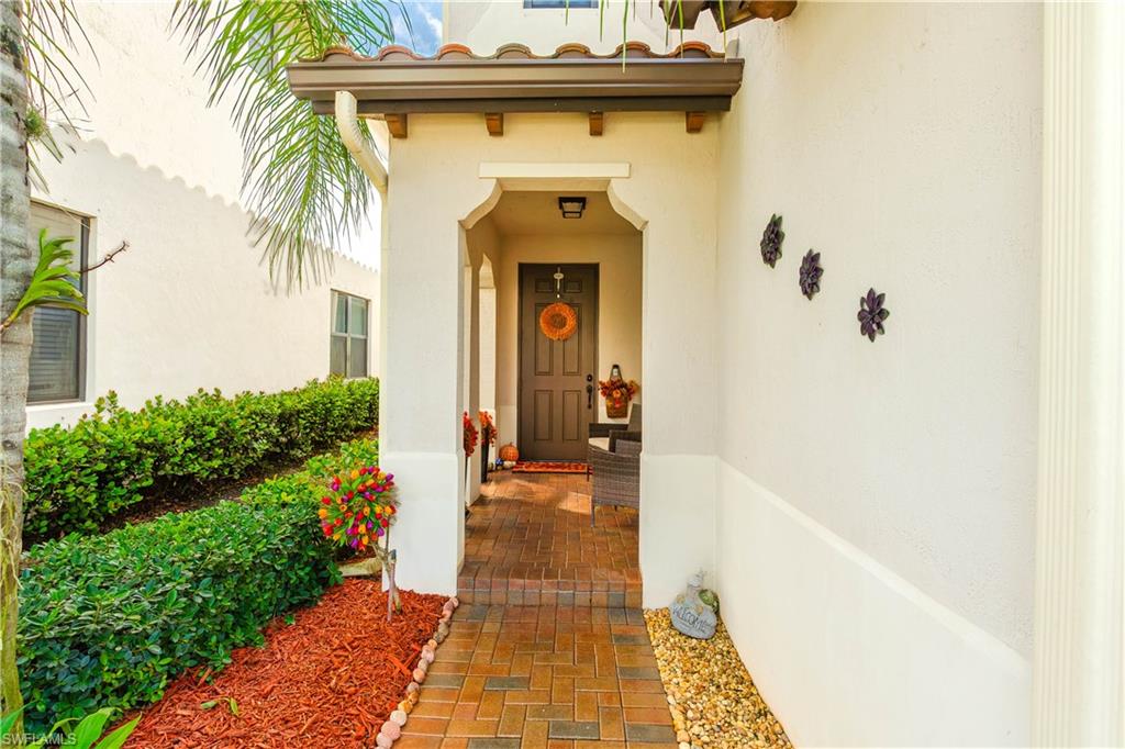 5092 Beckton Road Ave Maria, FL 34142 - Photo 2 of 36 a front view of a house with a porch