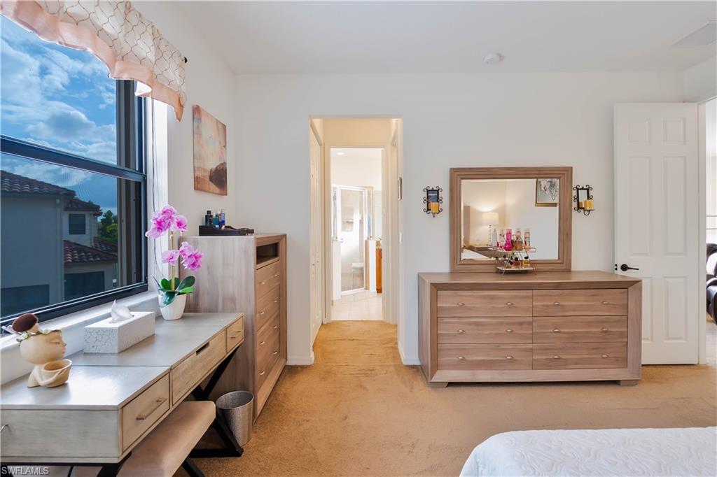 5092 Beckton Road Ave Maria, FL 34142 - Photo 23 of 36 a living room with furniture and a flat screen tv