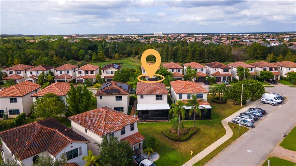 5092 Beckton Road Ave Maria, FL 34142 - Photo 34 of 36 an aerial view of a house with garden space and ocean view