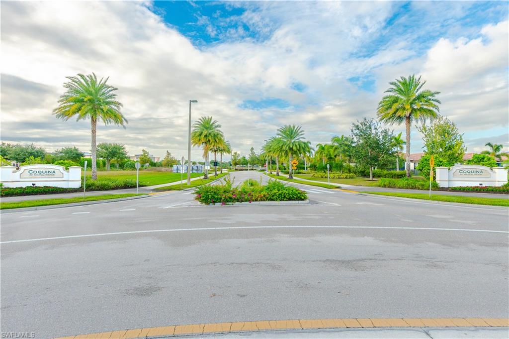 5092 Beckton Road Ave Maria, FL 34142 - Photo 35 of 36 a view of a swimming pool and a yard