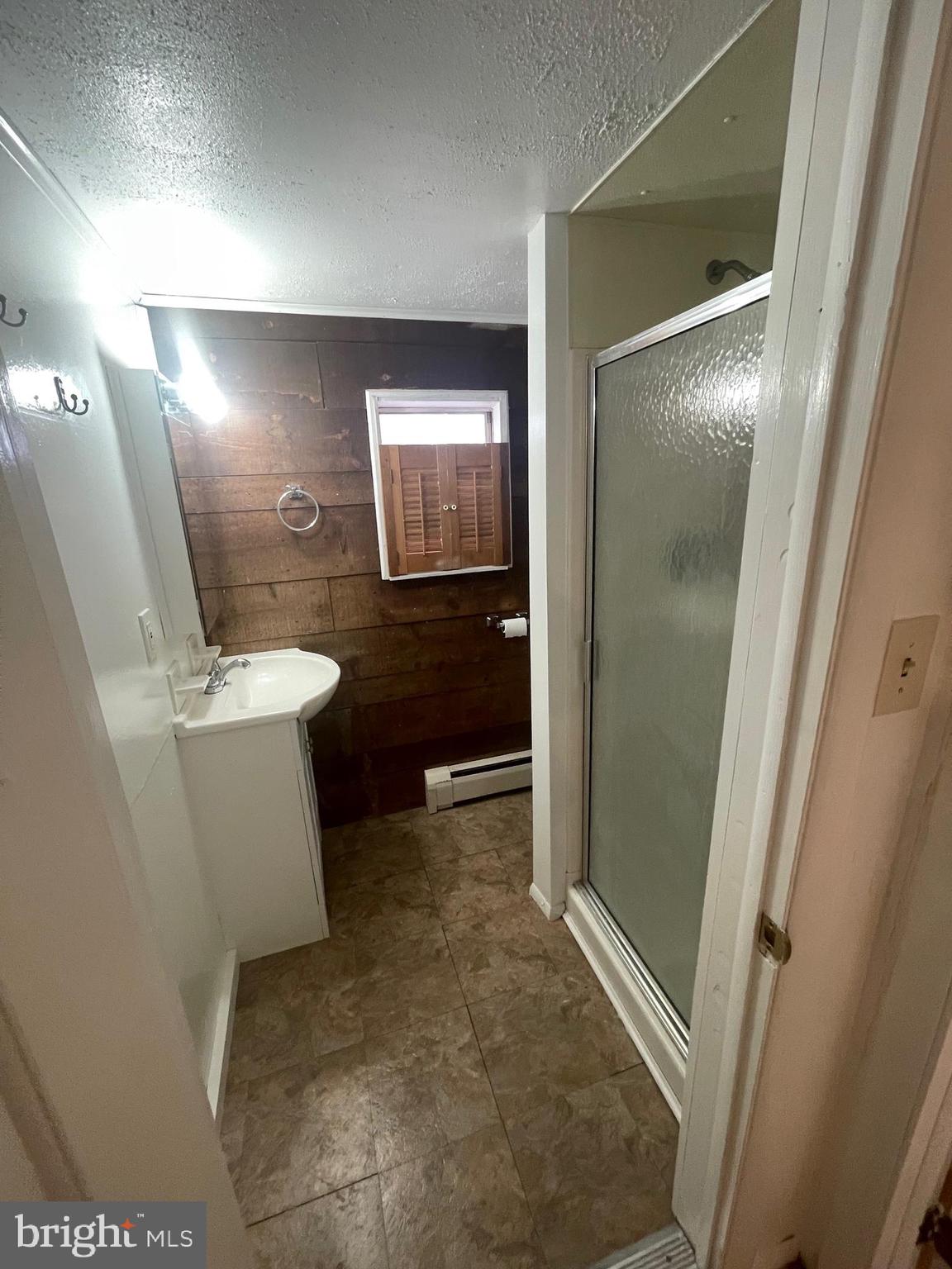 425 Rear Seventh Street New Cumberland, PA 17070 - Photo 11 of 23 a bathroom with a sink and a mirror
