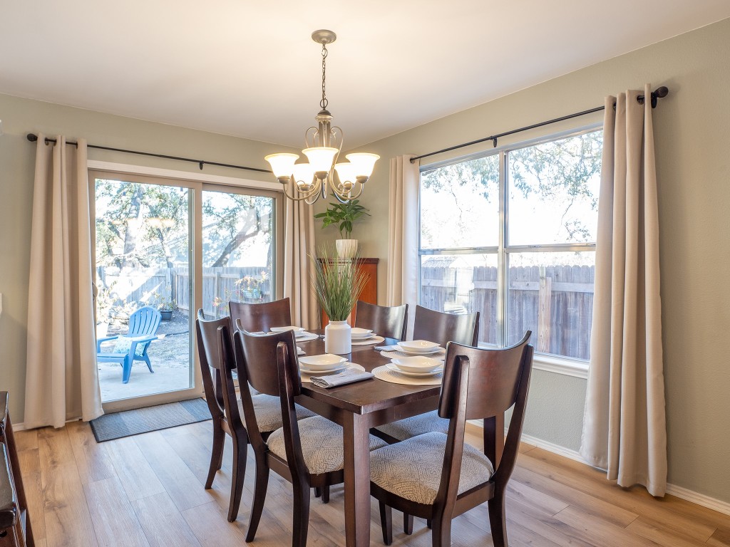 9610 Dalewood Drive Austin, TX 78729 - Photo 11 of 27 a view of a dining room with furniture window and wooden floor