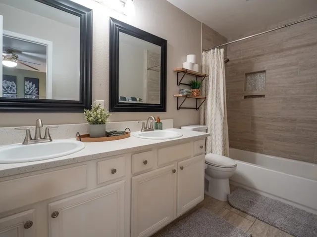 a bedroom with a bed and a night stand