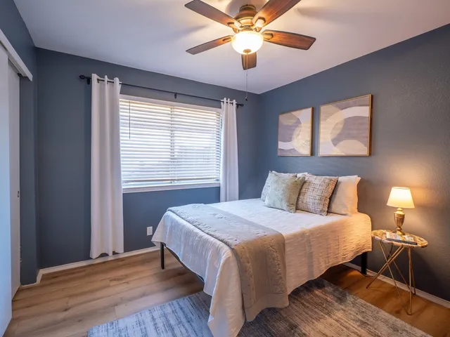 a bathroom with a double vanity sink mirror double and bathtub