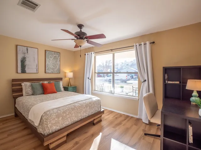 a bedroom with a bed and window