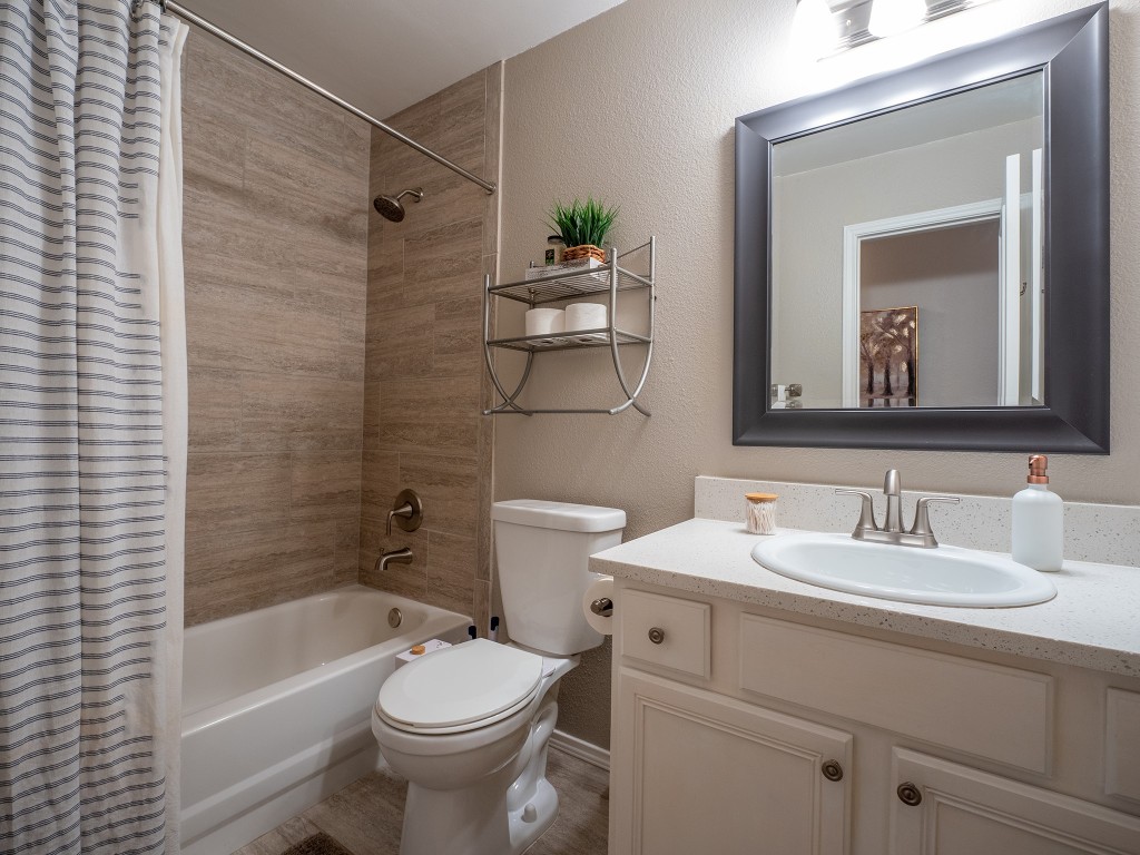 9610 Dalewood Drive Austin, TX 78729 - Photo 22 of 27 a bathroom with a sink a toilet and shower