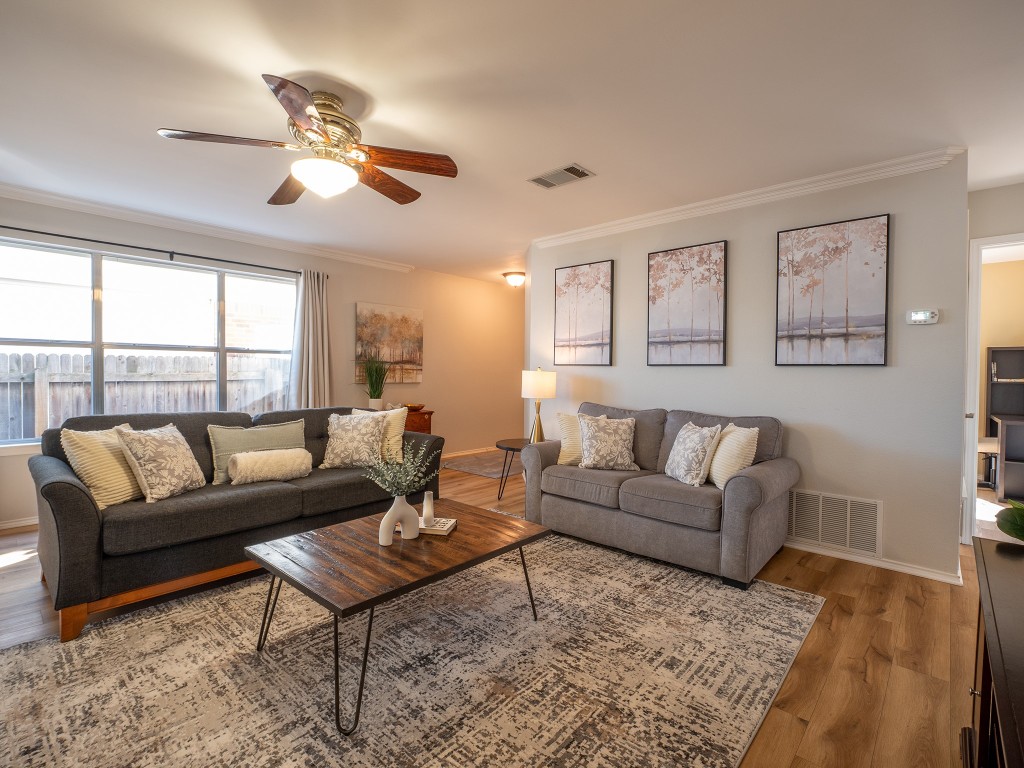 9610 Dalewood Drive Austin, TX 78729 - Photo 6 of 27 a living room with furniture and a large window