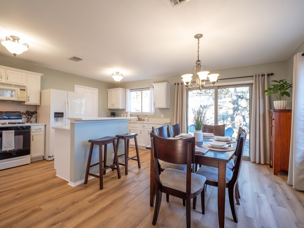 9610 Dalewood Drive Austin, TX 78729 - Photo 8 of 27 a dining room with furniture and wooden floor