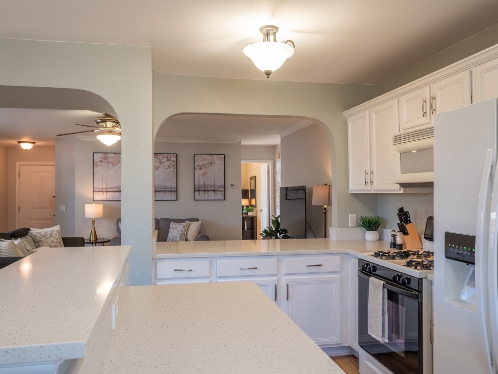 9610 Dalewood Drive Austin, TX 78729 - Photo 27 of 27 a kitchen with stainless steel appliances a sink stove and cabinets