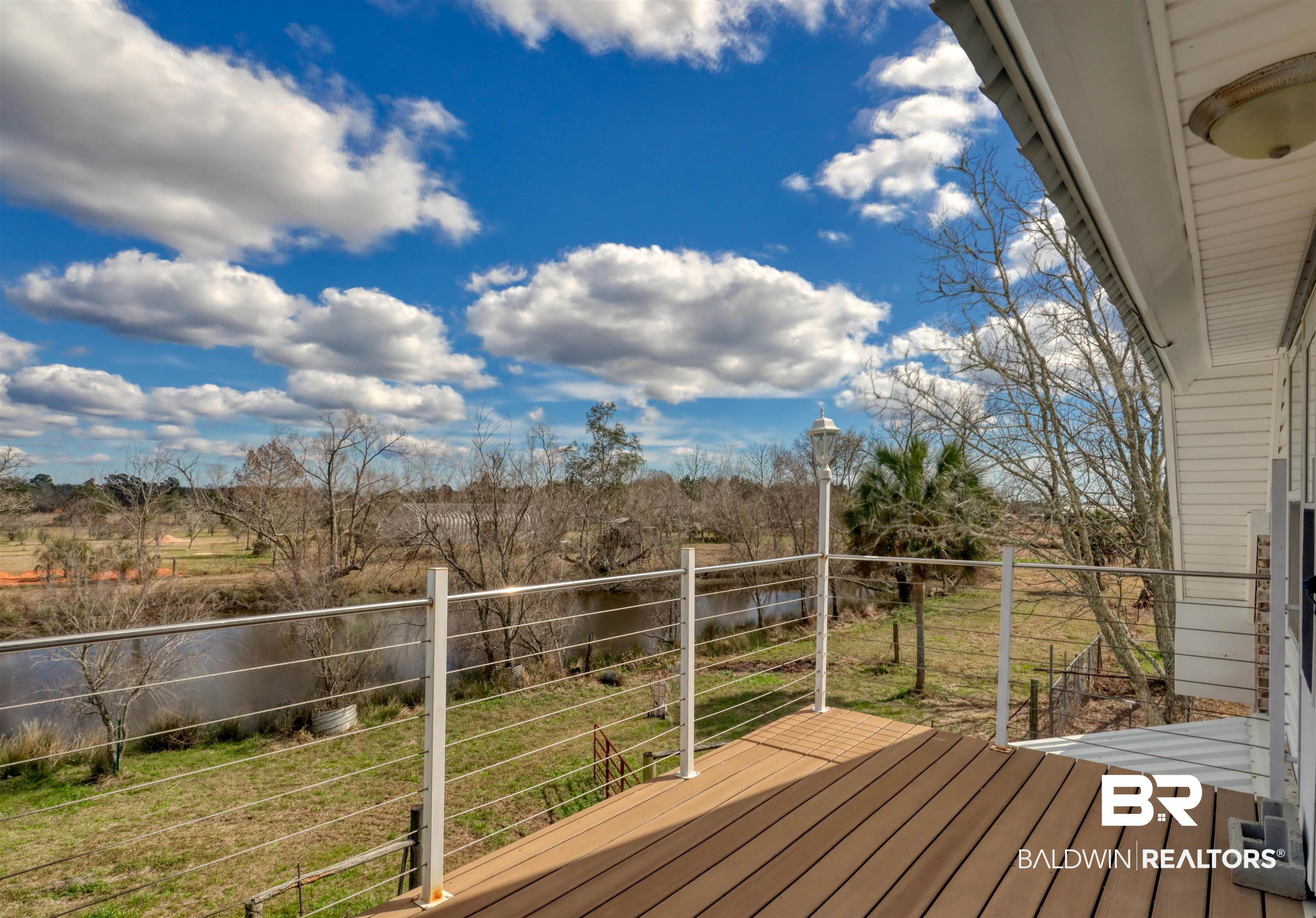 28461 Gardner Road Elberta, AL 36530 - Photo 27 of 46 Wooden terrace featuring a lawn
