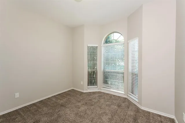a view of a livingroom with the floor to ceiling window