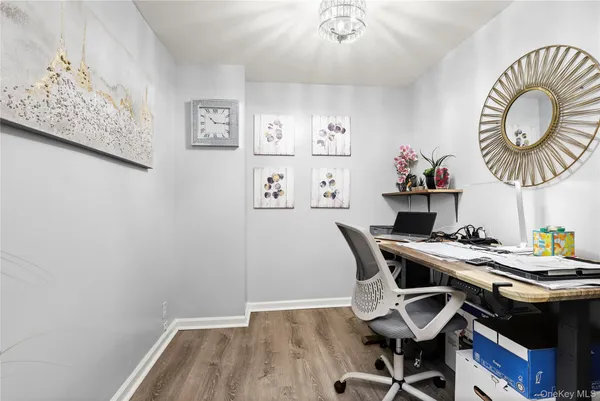 a workspace with furniture and wooden floor