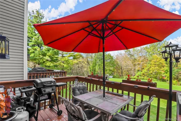 a view of balcony with outdoor seating and wooden floor