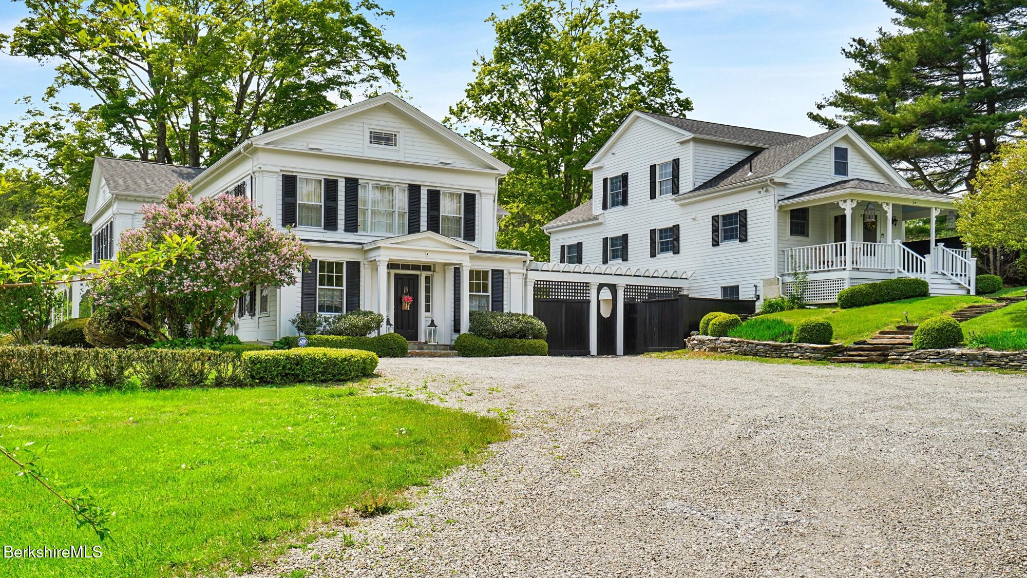 2650 Swamp Road Richmond, MA 01254 - Photo 3 of 49 a front view of a house with a garden and plants
