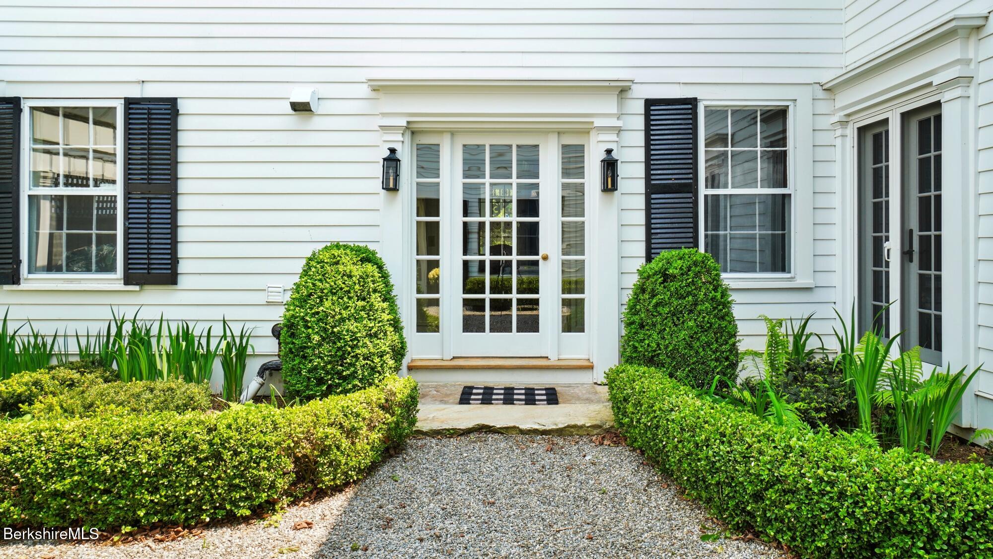 2650 Swamp Road Richmond, MA 01254 - Photo 32 of 49 a front view of a house with a garden