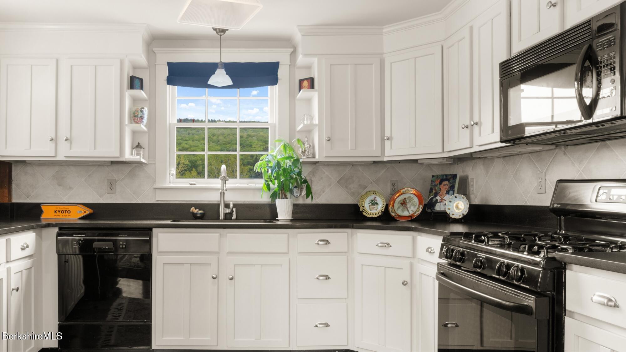 2650 Swamp Road Richmond, MA 01254 - Photo 34 of 49 a kitchen with stainless steel appliances granite countertop a sink stove top oven and cabinets