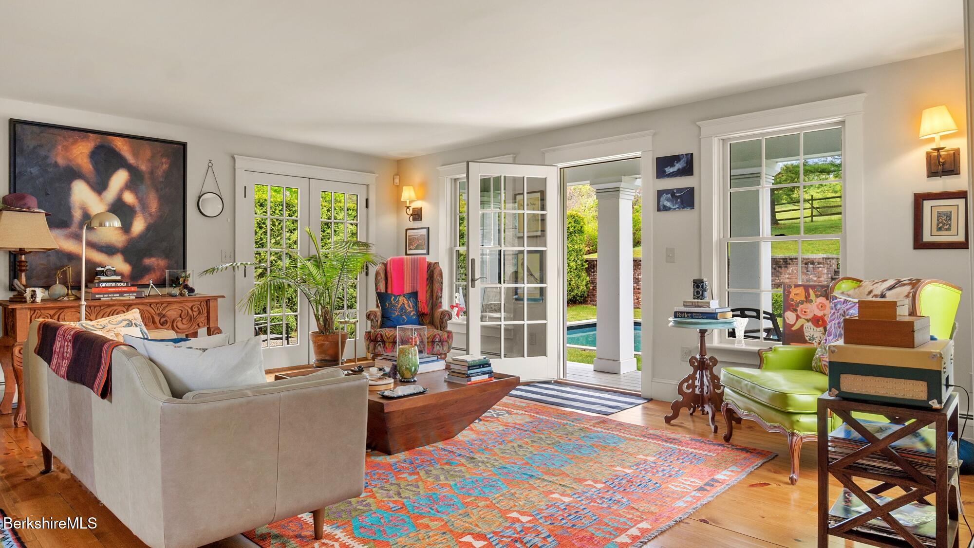 2650 Swamp Road Richmond, MA 01254 - Photo 35 of 49 a living room with fireplace furniture and a large window