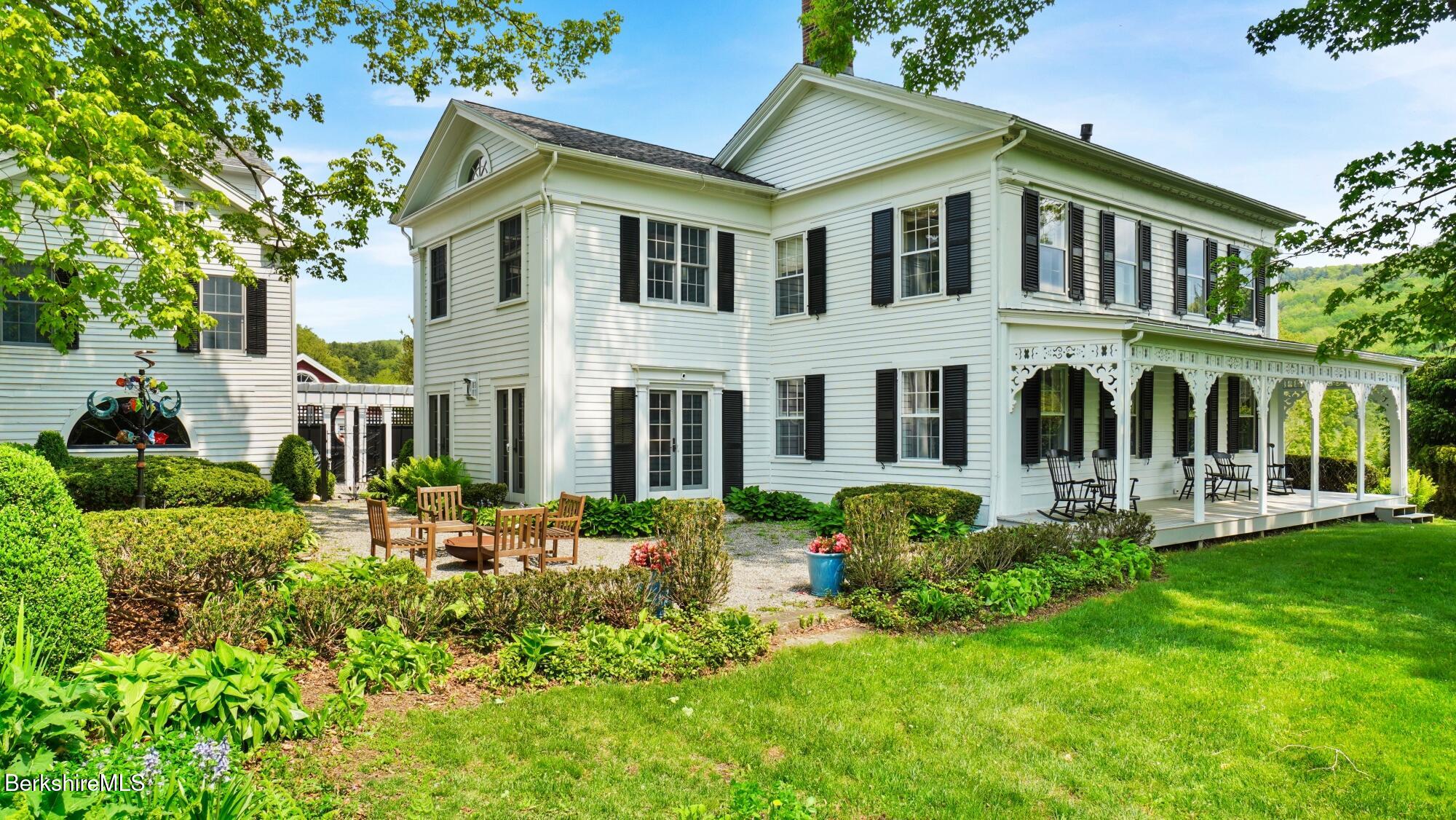2650 Swamp Road Richmond, MA 01254 - Photo 4 of 49 a front view of a house with a garden