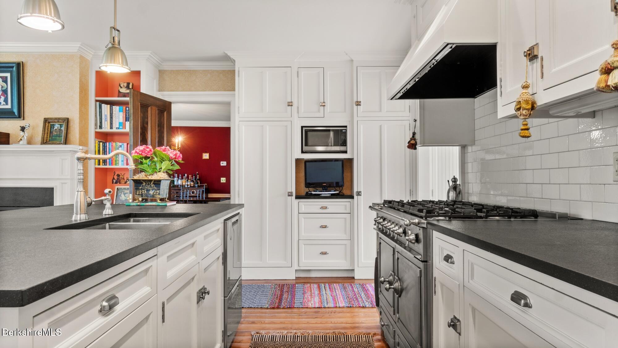 2650 Swamp Road Richmond, MA 01254 - Photo 6 of 49 a kitchen with stainless steel appliances granite countertop a sink stove and refrigerator
