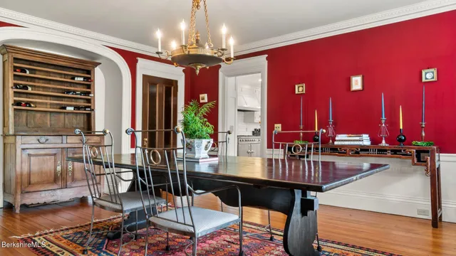 a living room with furniture pool table and a fireplace